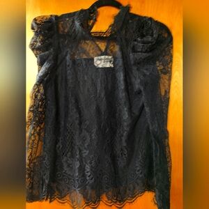 Black lace top. Long sleeve. Size Small.